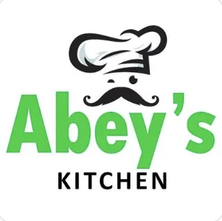 Original Abey's Kitchen logo using bright green lettering, a chef hat and moustache symbol