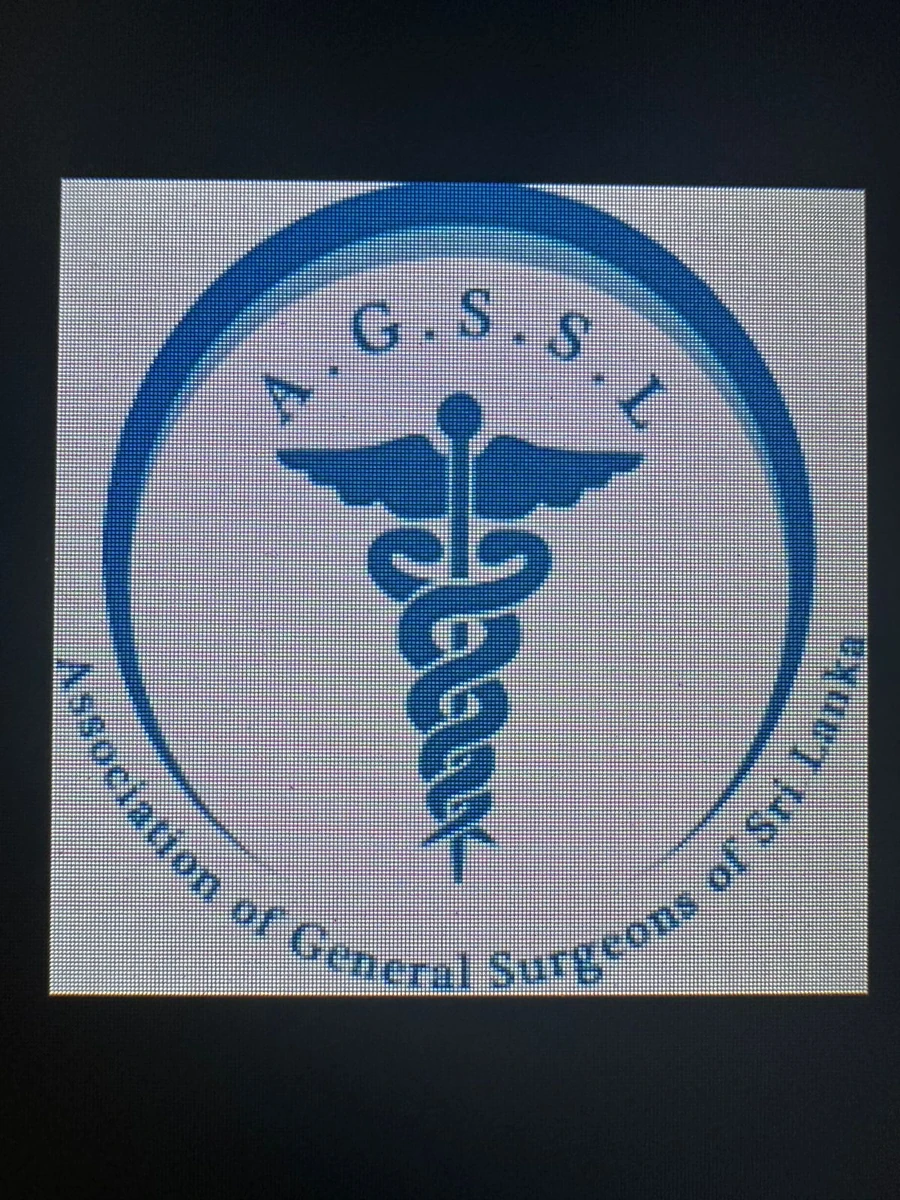 Photograph of the previous AGSSL emblem using a winged double-snake caduceus-style symbol inside a circular border.